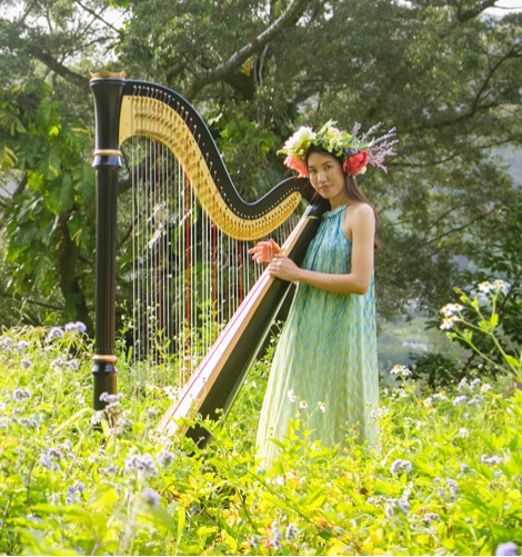 Lacey Chu playing a harp